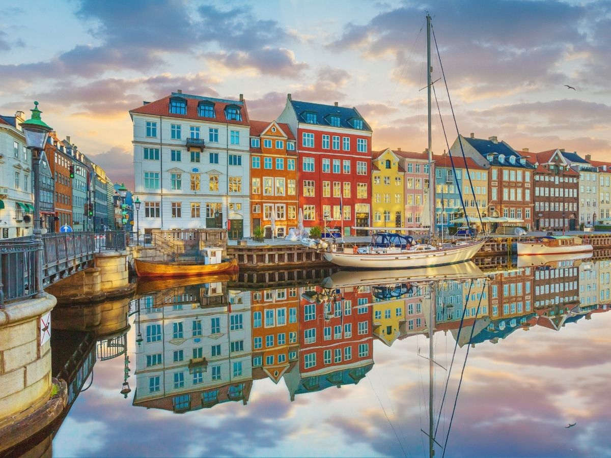 Copenhagen Nyhavn waterfront and colorful buildings with prepaid travel eSIM providing reliable mobile data connectivity.