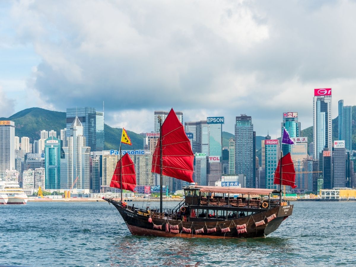 Victoria Harbour skyline and illuminated skyscrapers with prepaid travel eSIM providing reliable mobile data connectivity.