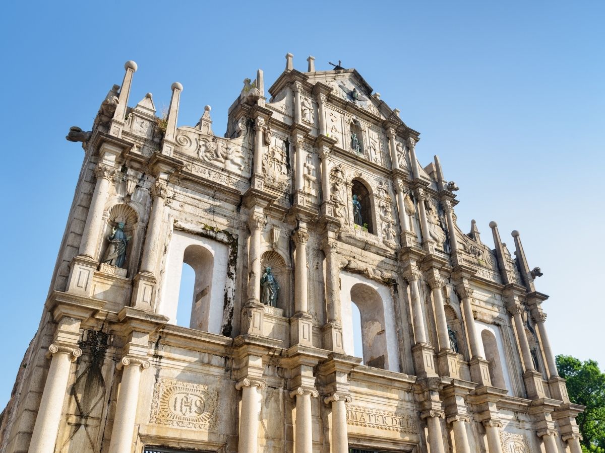 Ruins of St. Paul's and historic Macau streets with prepaid travel eSIM providing reliable mobile data connectivity.