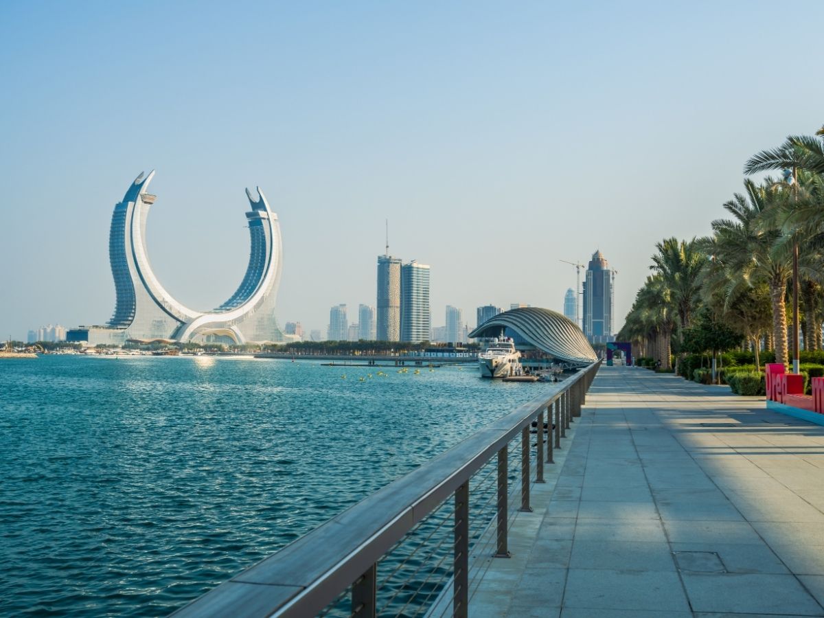 Doha waterfront skyline and modern skyscrapers with prepaid travel eSIM providing reliable mobile data connectivity.